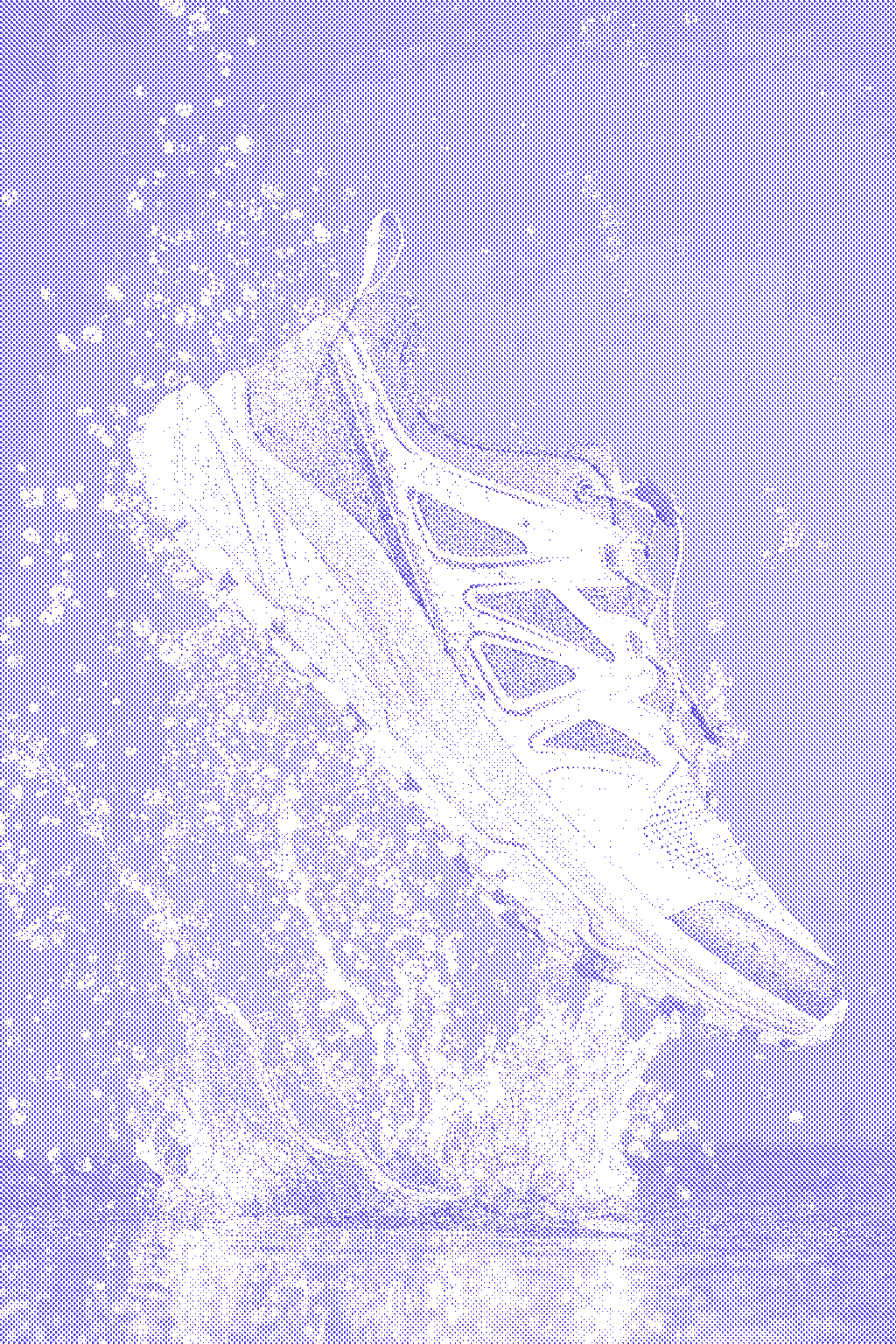 Olive and orange trail running shoe kicking up a burst of water