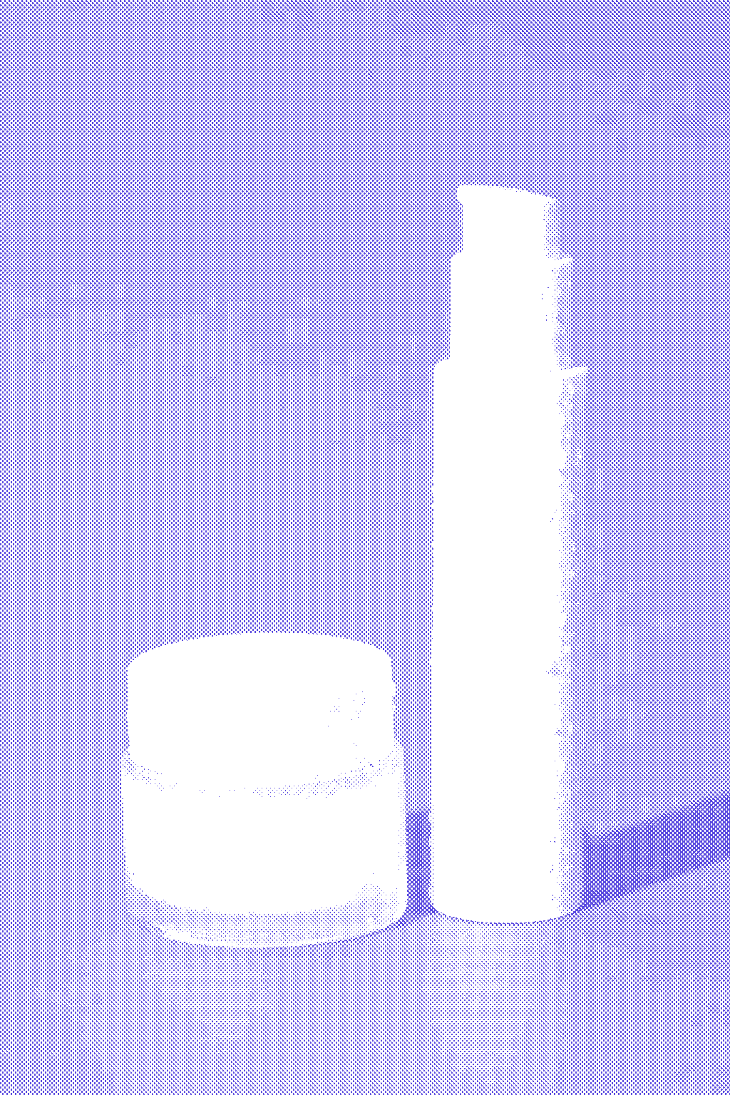 White pump bottle and cream jar covered in water droplets